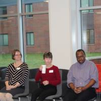 Students and faculty discussing important tasks like the students' futures at GVSU and beyond